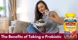 Healthy woman eating a salad on a couch